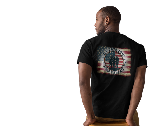 A classic USA Some Gave All Tee featuring a man in a black shirt with a flag, embodying patriotism. Unisex jersey tee with ribbed knit collars, taping on shoulders, and dual side seams for durability.