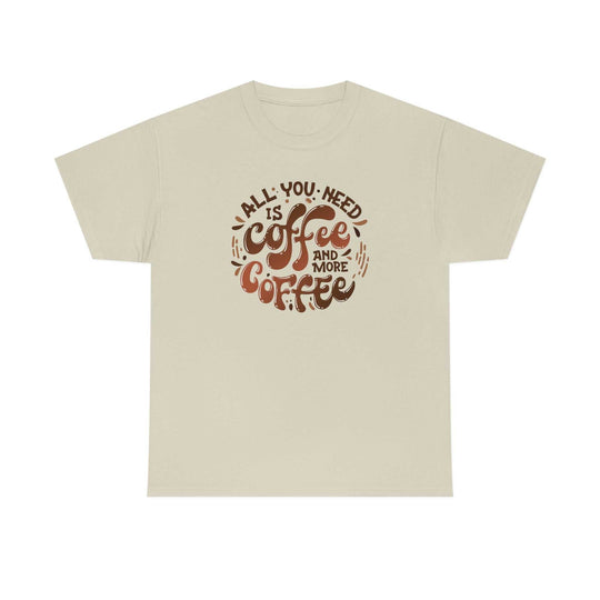 Unisex heavy cotton tee, All You Need is Coffee Tee, featuring brown text on a white shirt. Classic fit with no side seams, ribbed knit collar, and durable tape on shoulders. 100% cotton. Sizes S-5XL.