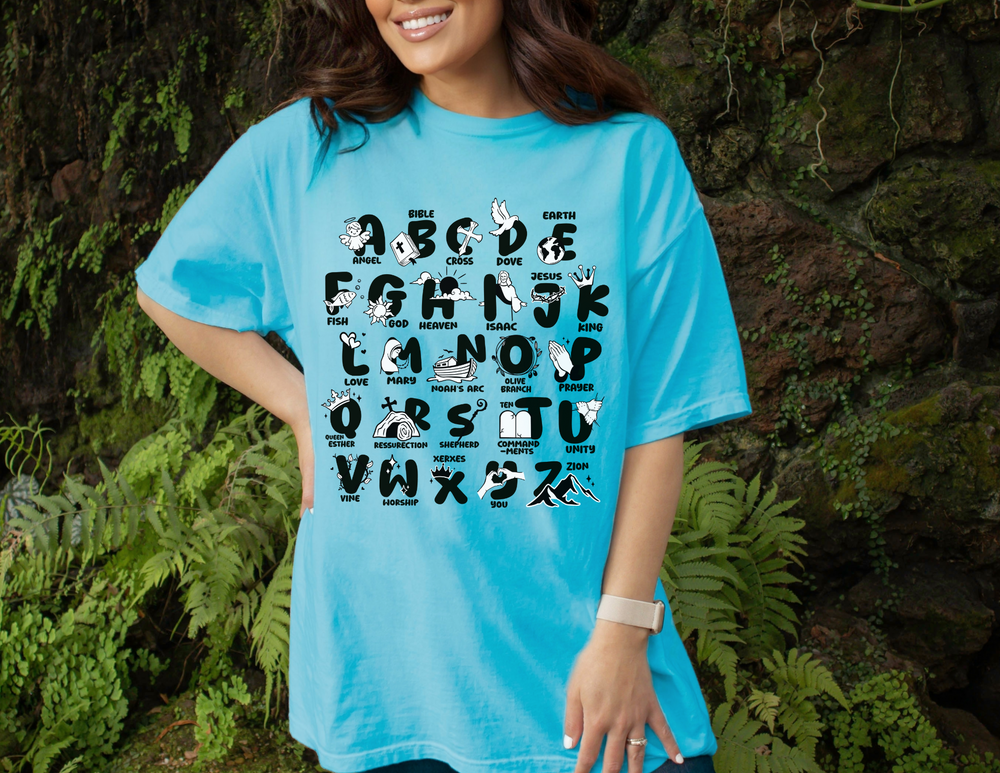 A relaxed fit Bible Alphabet Tee crafted from 100% ring-spun cotton. Garment-dyed for extra coziness, featuring double-needle stitching for durability and a seamless design for a tubular shape.