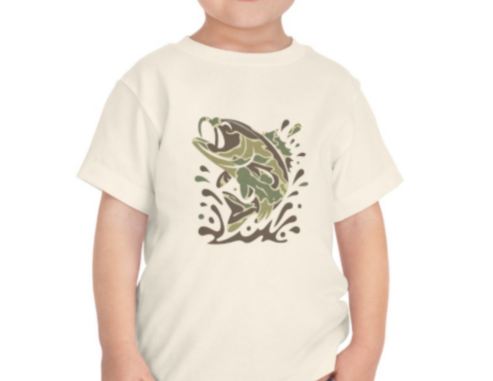 Camo Fish Toddler Tee featuring a leaping fish design in camo tones on a light-colored short sleeve shirt, made from soft, breathable cotton for comfort.