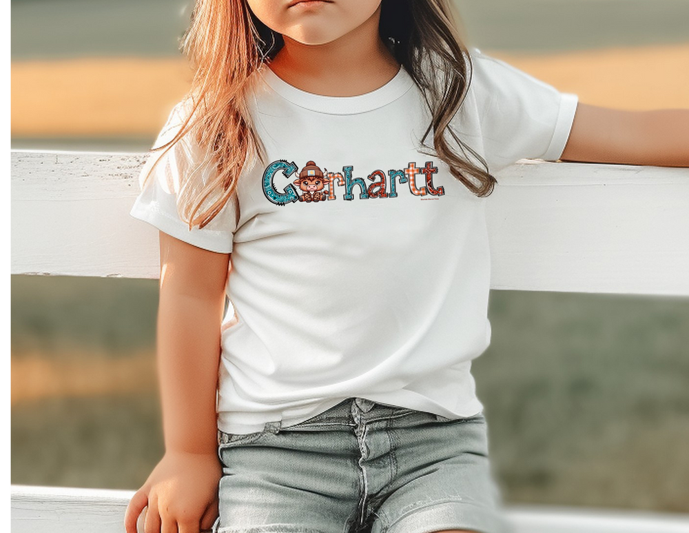 A Cowhartt Toddler Tee, soft and gentle on sensitive skin, featuring durable print on light fabric. Classic fit with tear-away label, perfect for little adventures. Sizes: 2T, 3T, 4T, 5-6T.