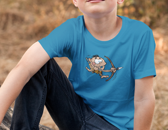 A kid's Caveman Archery Tee, featuring a cartoon of a caveman shooting a bow and arrow. 100% cotton, twill tape shoulders, tear-away label, and curl-resistant collar for durability. Classic fit, ideal for everyday wear.