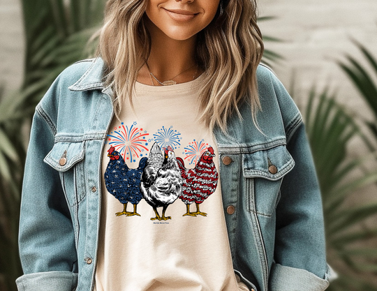 A classic unisex jersey tee featuring a woman in a denim jacket and sunglasses. Chicken 4th Tee with ribbed knit collar, 100% cotton, light fabric, and tear away label. Fits true to size.