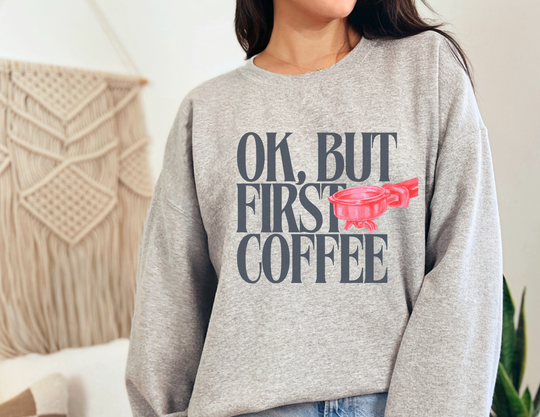Unisex crewneck sweatshirt titled Ok But First Coffee Crew, featuring a classic fit and ribbed collar, made from a comfortable polyester-cotton blend.