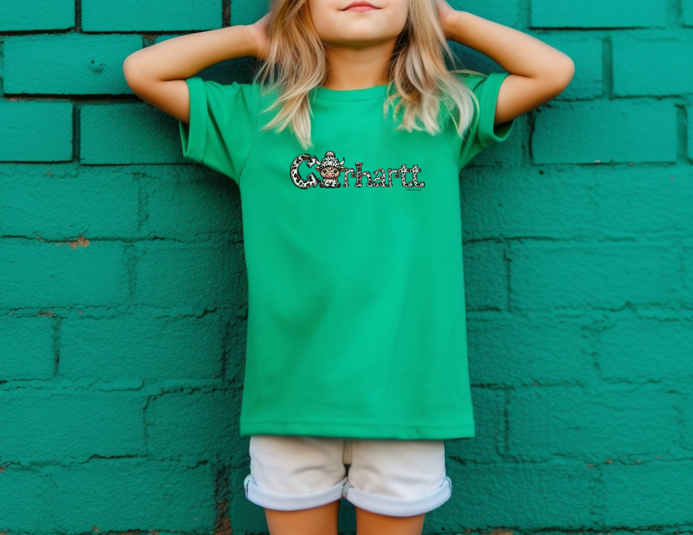 A kid's tee featuring a cartoon cow with a hat, made of 100% combed ringspun cotton for comfort and agility. Classic fit, soft-washed, and garment-dyed for day-long wear. Cowhartt Cow Kids Tee.