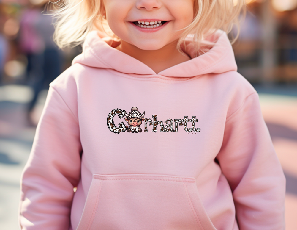 Toddler hoodie with jersey-lined hood, cover-stitched details, and side seam pockets. Cowhartt Cow Toddler Hoodie for lasting coziness. Designed for comfort and durability.