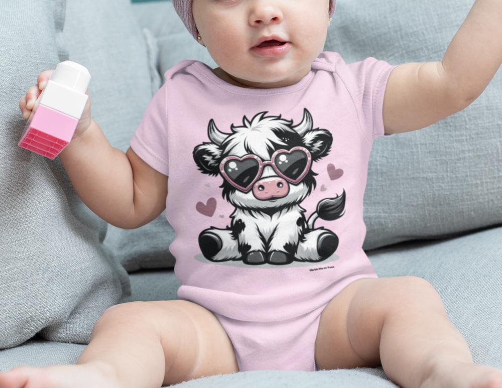 A cute cow onesie for infants, featuring a baby in a hat and bodysuit. Made of 100% cotton, with ribbed bindings for durability and plastic snaps for easy changing. Ideal for 0-24M sizes.