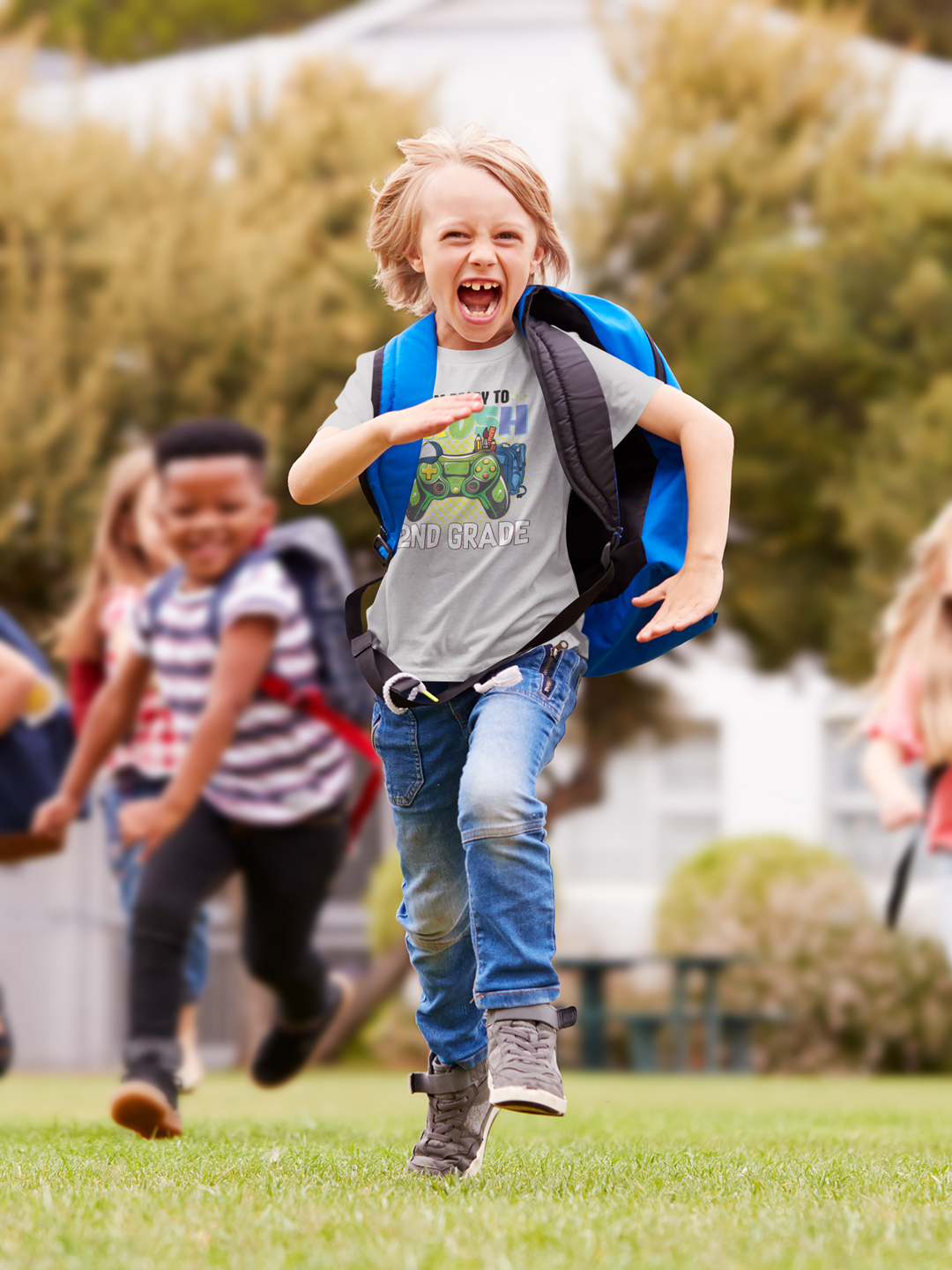A group of kids running outside, a boy with a backpack, and a person walking. The I'm Ready to Crush 2nd Grade Kids Tee in 100% cotton, light fabric, classic fit, tear-away label. Ideal for everyday wear.