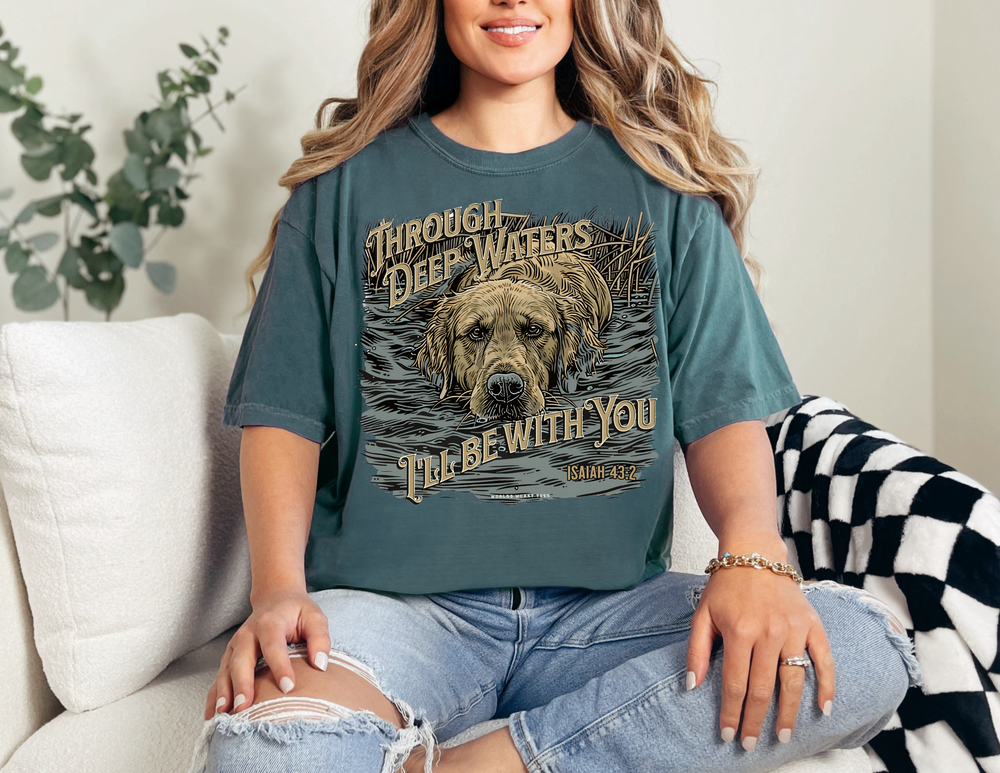 A relaxed fit Through Deep Waters Hunting Tee made of 100% ring-spun cotton. Soft-washed, garment-dyed fabric for coziness. Double-needle stitching for durability, no side-seams for shape retention.