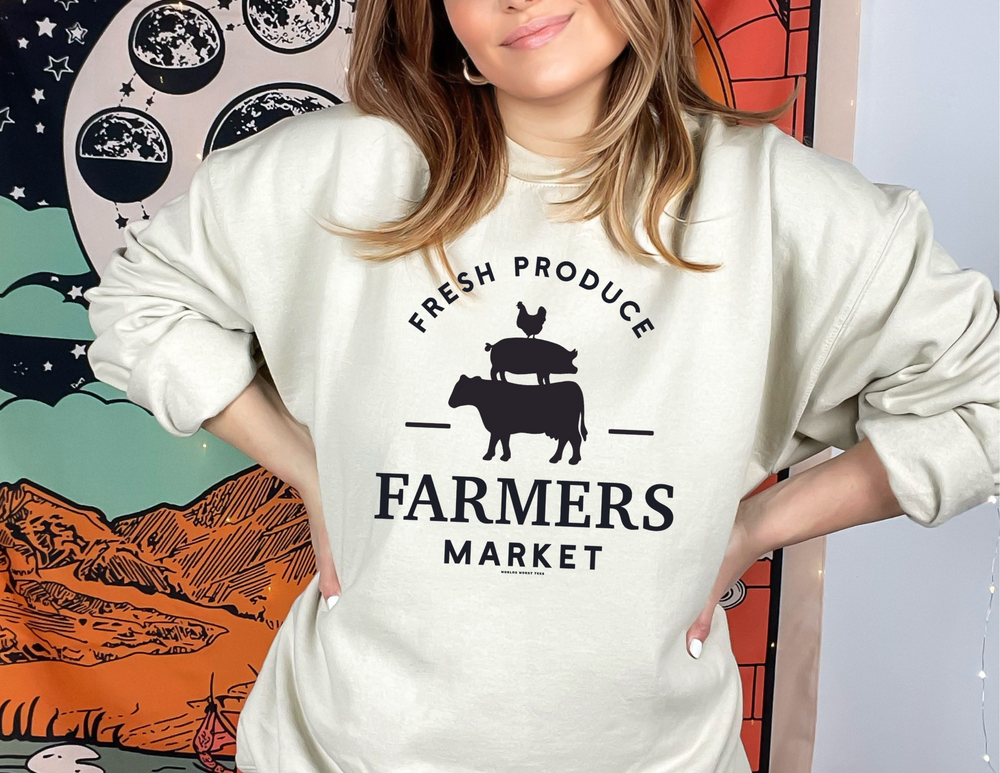 A unisex heavy blend crewneck sweatshirt from Worlds Worst Tees, titled Farmers Market Crew. Features ribbed knit collar, no itchy side seams, and a loose fit. Made of 50% cotton and 50% polyester.