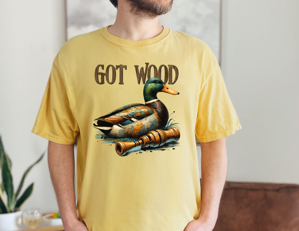 A man in a Got Wood Tee, featuring a duck design, made of soft ring-spun cotton. Relaxed fit, double-needle stitching for durability, and seamless sides for a tubular shape. Ideal for daily wear.