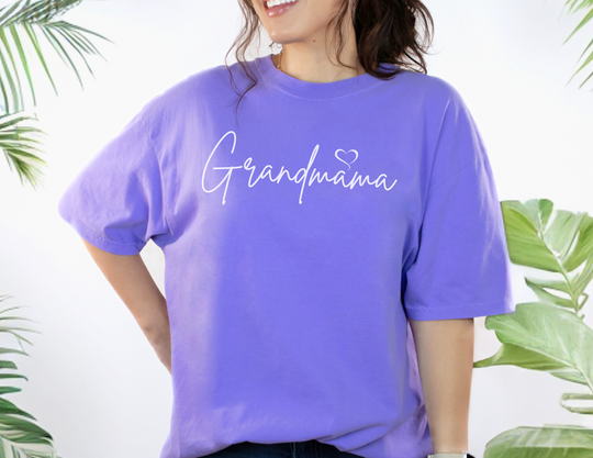 A relaxed fit Grandmama Tee in purple, made of 100% ring-spun cotton. Soft-washed and garment-dyed for coziness, with double-needle stitching for durability and a seamless design for shape retention.