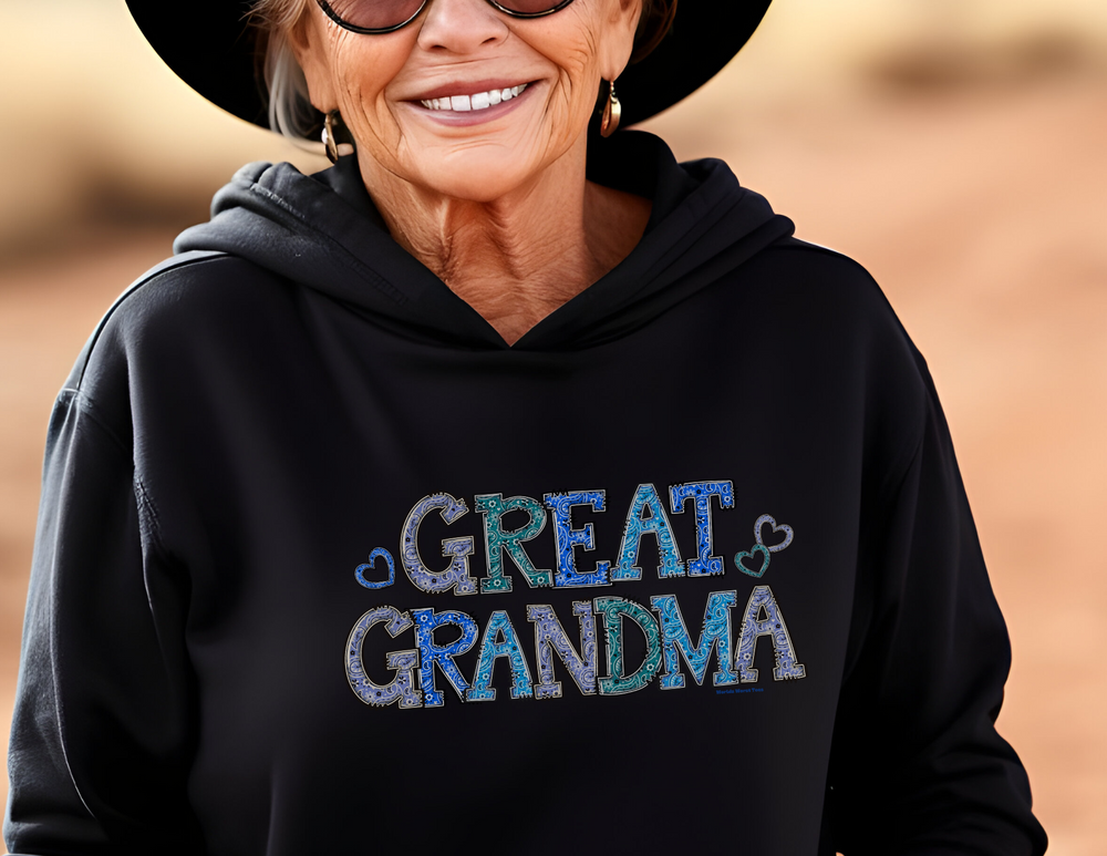 Great Grandma Hoodie: Unisex heavy blend hooded sweatshirt in black, featuring a woman in a hat and sunglasses. Cotton-polyester fabric, kangaroo pocket, and matching drawstring. Cozy, stylish, and true to size.