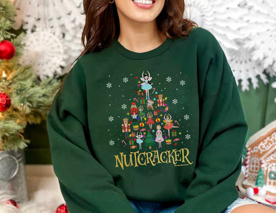 A loose-fit Nutcracker Crew sweatshirt in medium-heavy fabric, featuring a cartoon nutcracker design. Unisex, ribbed knit collar, 50% cotton, 50% polyester blend for comfort. Sewn-in label, true to size.