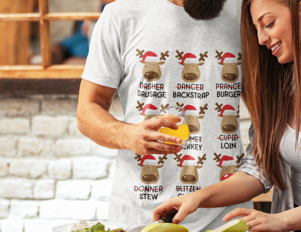 A premium Reindeer Names Tee for men, featuring a man and woman outdoors, holding orange juice glasses. Comfy, light, ribbed knit collar, roomy fit, 100% cotton. Sizes XS-4XL.