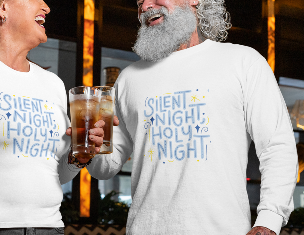 A man and woman holding a glass of liquid, a man holding a glass of liquid, a hand holding a glass of liquid, a person holding a glass of liquid, and a person holding a glass of liquid. A man with a beard and mustache in a white shirt with blue text. Alt text: Silent Night Matching Long Sleeve Tee featuring a man in a white shirt holding a glass, embodying casual elegance and quality.