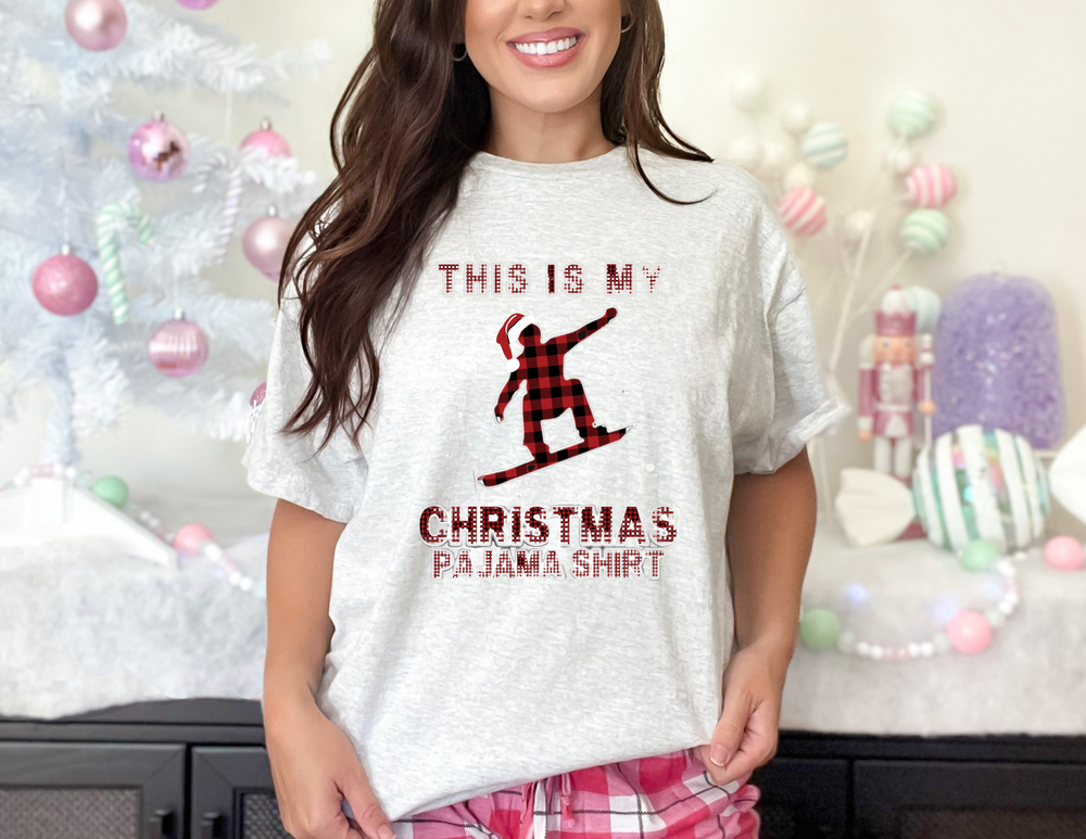 A unisex jersey tee featuring a snowboarder design, perfect for Christmas vibes. Soft cotton, ribbed knit collar, and quality print for a loved favorite. Sizes XS to 3XL. Made for comfort and style.