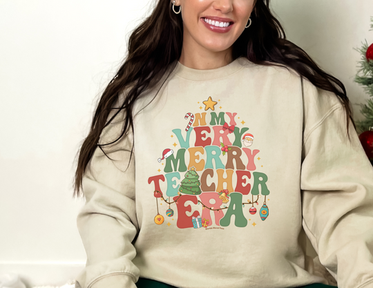 Unisex heavy blend crewneck sweatshirt, Verry Merry Teacher Crew, loose fit, ribbed knit collar, 50% cotton, 50% polyester, medium-heavy fabric, sewn-in label. Woman smiling at camera.
