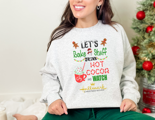 A unisex heavy blend crewneck sweatshirt featuring a festive design with a snowman, gingerbread man, and Christmas tree. Made of 50% cotton and 50% polyester, this loose-fit sweater is ideal for cozy Christmas movie nights. Sewn-in label, ribbed knit collar, and medium-heavy fabric. From 'Worlds Worst Tees'.