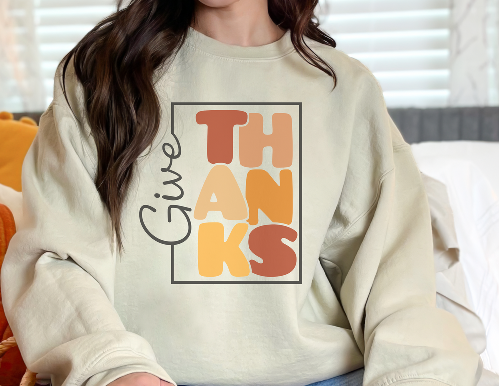 A heavy blend crewneck sweatshirt for all, featuring a ribbed knit collar for shape retention. Made of 50% cotton and 50% polyester, with a loose fit and no itchy side seams. Give Thanks Crewneck by Worlds Worst Tees.