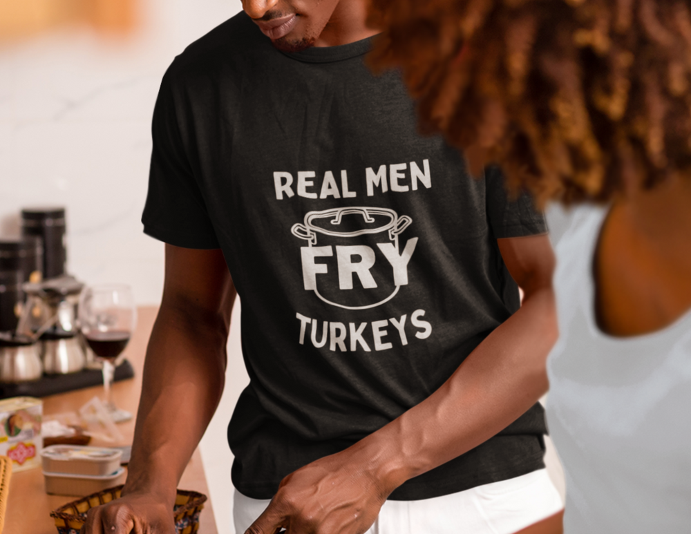 A Real Men Fry Turkey Tee, a premium fitted men’s shirt for workouts or daily wear. Made of 100% combed, ring-spun cotton with ribbed knit collar and side seams for durability and comfort.