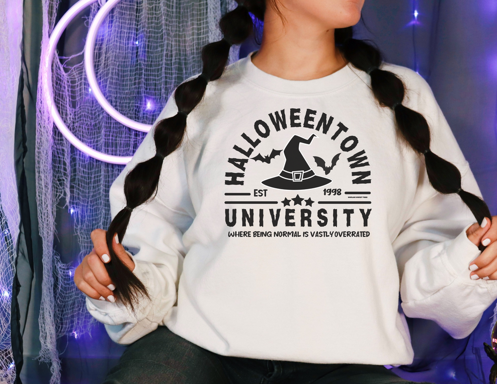Unisex Halloweentown University Crew sweatshirt, ideal for any situation. Made of 50% cotton, 50% polyester blend with ribbed knit collar. Medium-heavy fabric, loose fit, sewn-in label, true to size.