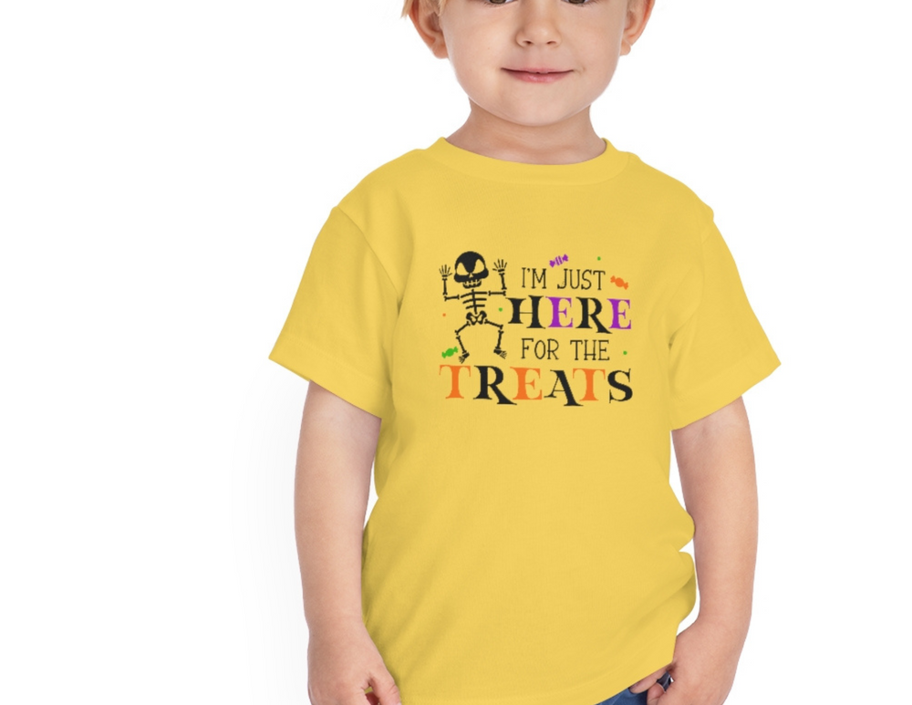 Toddler tee with short sleeves, featuring a child in a yellow shirt. Made of 100% Airlume combed and ring-spun cotton for comfort. Title: Here for the Treats Toddler Tee.