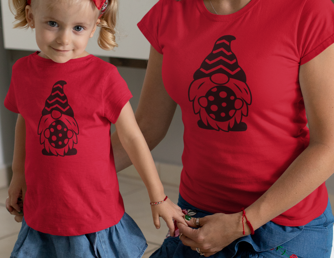 A woman and child in matching Mommy and Me Easter Gnome Tees, showcasing classic fit, ribbed knit collar, and durable tape on shoulders. Unisex heavy cotton tee for casual style.