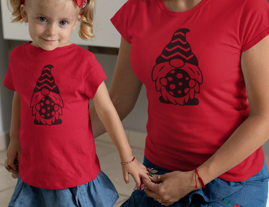 A woman and child in matching Mommy and Me Easter Gnome Tees, showcasing classic fit, ribbed knit collar, and durable tape on shoulders. Unisex heavy cotton tee for casual style.