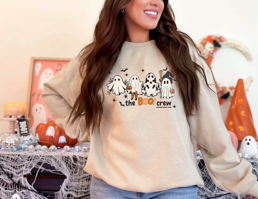 A cozy unisex heavy blend crewneck sweatshirt featuring a smiling woman in a ghost-themed sweater. Comfortable polyester-cotton fabric, ribbed knit collar, and no itchy side seams. Product title: Boo Crew Crew.