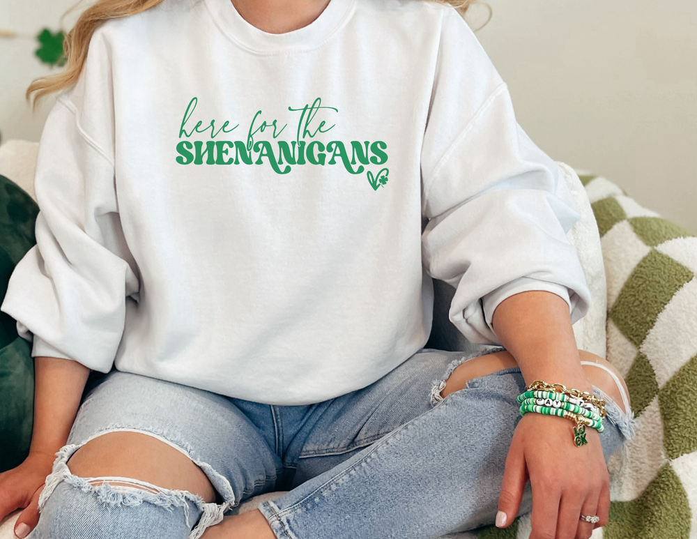 Unisex Here for the Shenanigans Crewneck sweatshirt, featuring ribbed knit collar, no itchy side seams, and a loose fit. Made of 50% cotton, 50% polyester blend for comfort. Medium-heavy fabric.