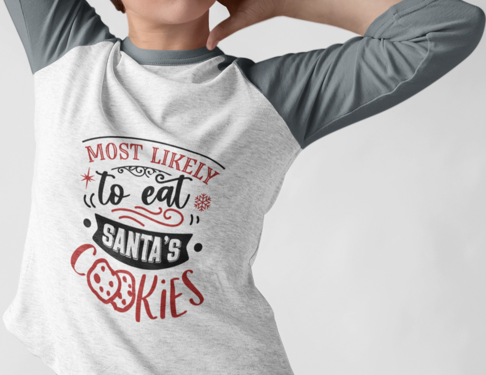 A person in a loose-fit Raglan sleeve tee with hands behind head. Eat Santa's Cookies 3/4 Raglan Tee. Unisex, light fabric tee with a sporty design. Perfect for casual style.