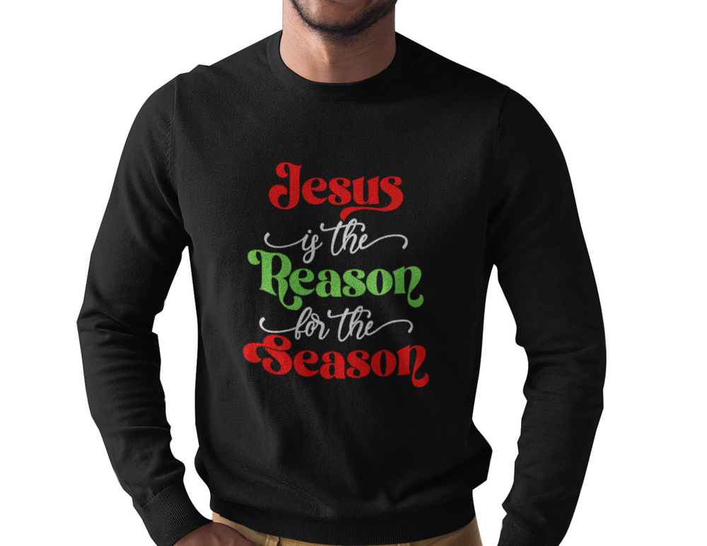 A man wearing a black Jesus is the Reason for the Season long sleeve tee, featuring a close-up of the logo on the fabric. Classic fit, 100% cotton, no side seams, taped shoulders for durability.