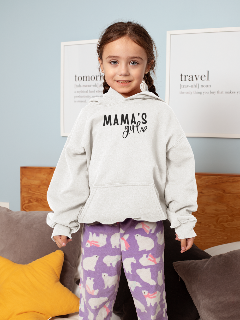 A toddler hoodie featuring a girl in pajamas with polar bears, designed for comfort with a jersey-lined hood, cover-stitched details, and side seam pockets. Product title: Mama's Girl Toddler Hoodie.
