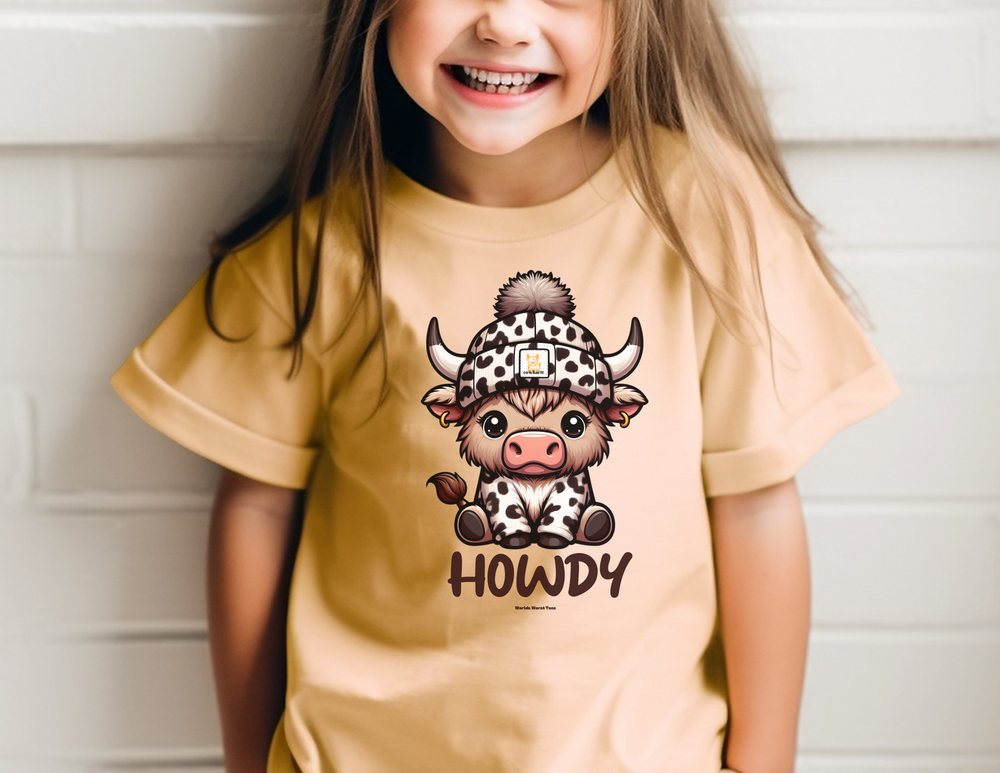 A Howdy Toddler Tee featuring a girl smiling with a cartoon cow hat. 100% combed ringspun cotton, light fabric, tear-away label, classic fit. Sizes: 2T, 3T, 4T, 5-6T. Dimensions: Width - 12.00-15.00in, Length - 15.50-18.50in, Sleeve length - 4.75-5.50in.