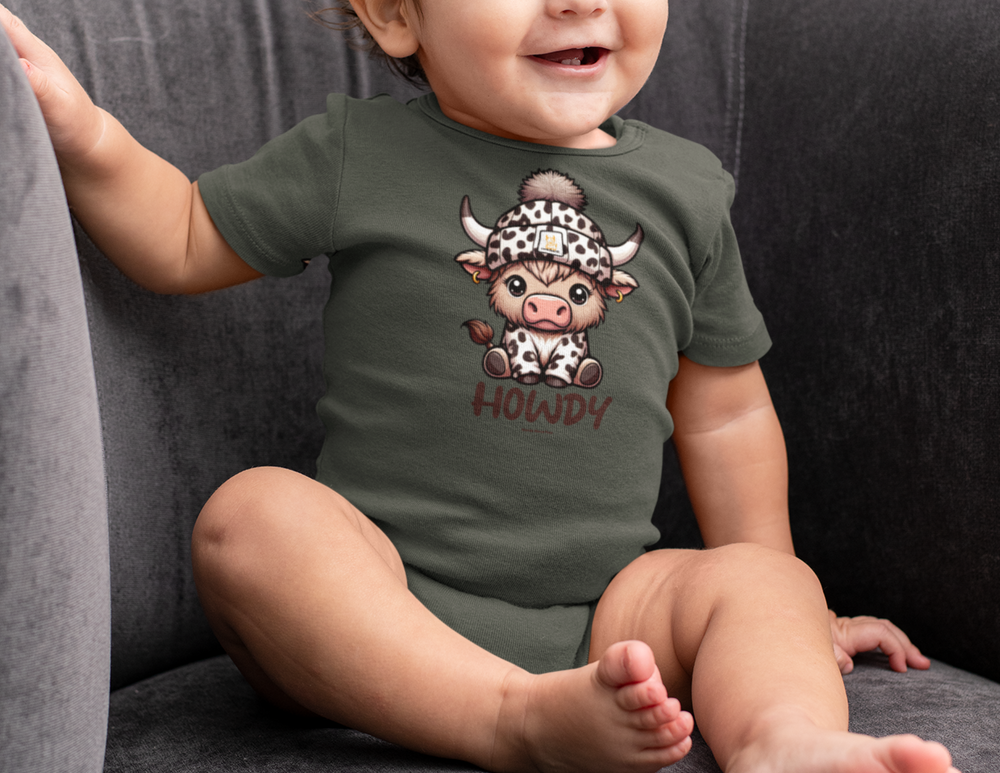 A baby in a Howdy Onesie bodysuit, sitting on a couch. The bodysuit is 100% cotton, with ribbed knitting for durability and plastic snaps for easy changing access. Perfect for infants.