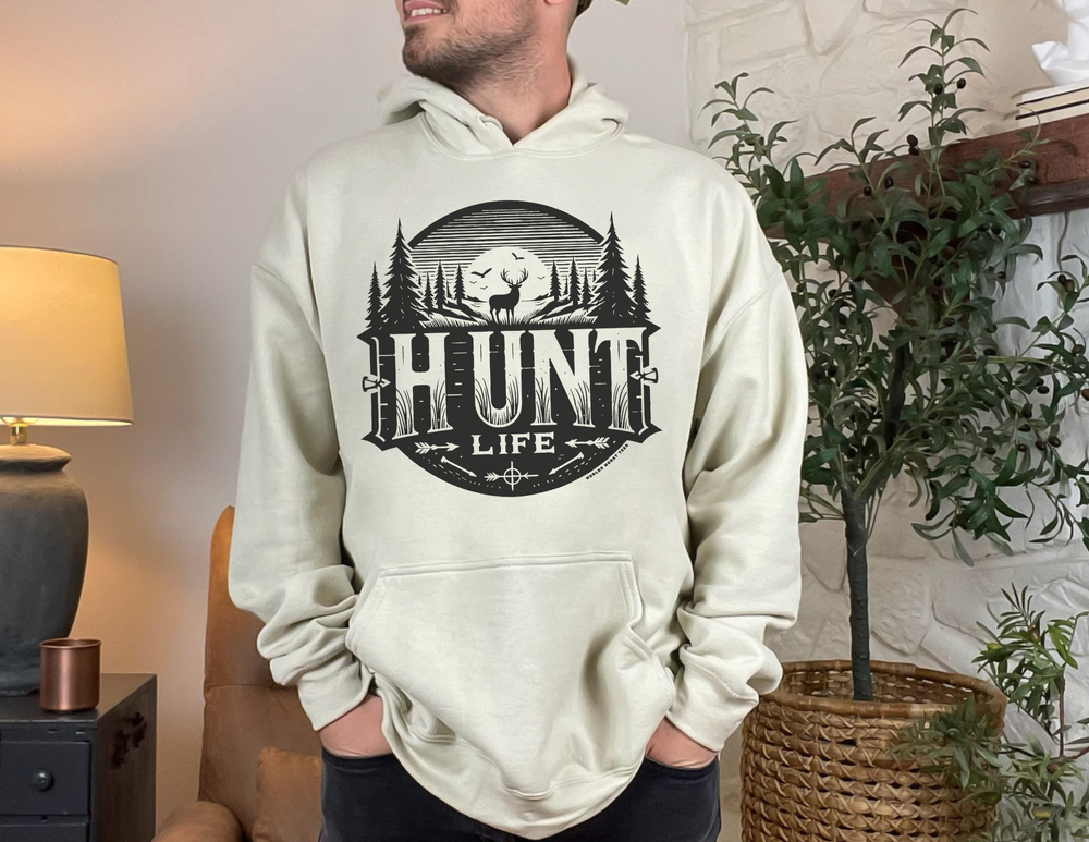 A heavy blend Hunt Life Hoodie in cotton and polyester, featuring a kangaroo pocket and drawstring hood. Medium-heavy fabric, no side seams, tear-away label, classic fit. Ideal for printing.