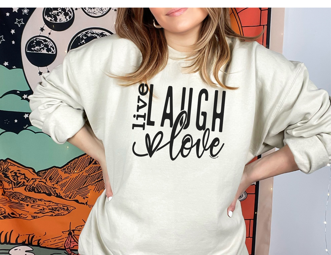 A unisex Live Laugh Love Crew heavy blend crewneck sweatshirt in medium-heavy fabric with ribbed knit collar. Features no itchy side seams, 50% Cotton 50% Polyester, loose fit, and sewn-in label.