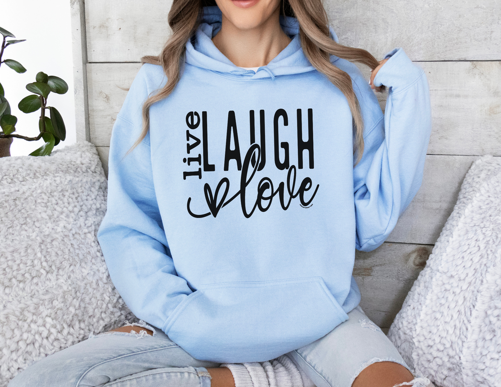 A cozy Live Laugh Love Hoodie in blue, featuring a kangaroo pocket and matching drawstring. Unisex, cotton-poly blend for warmth and comfort on chilly days. Classic fit, tear-away label, sizes S to 5XL.