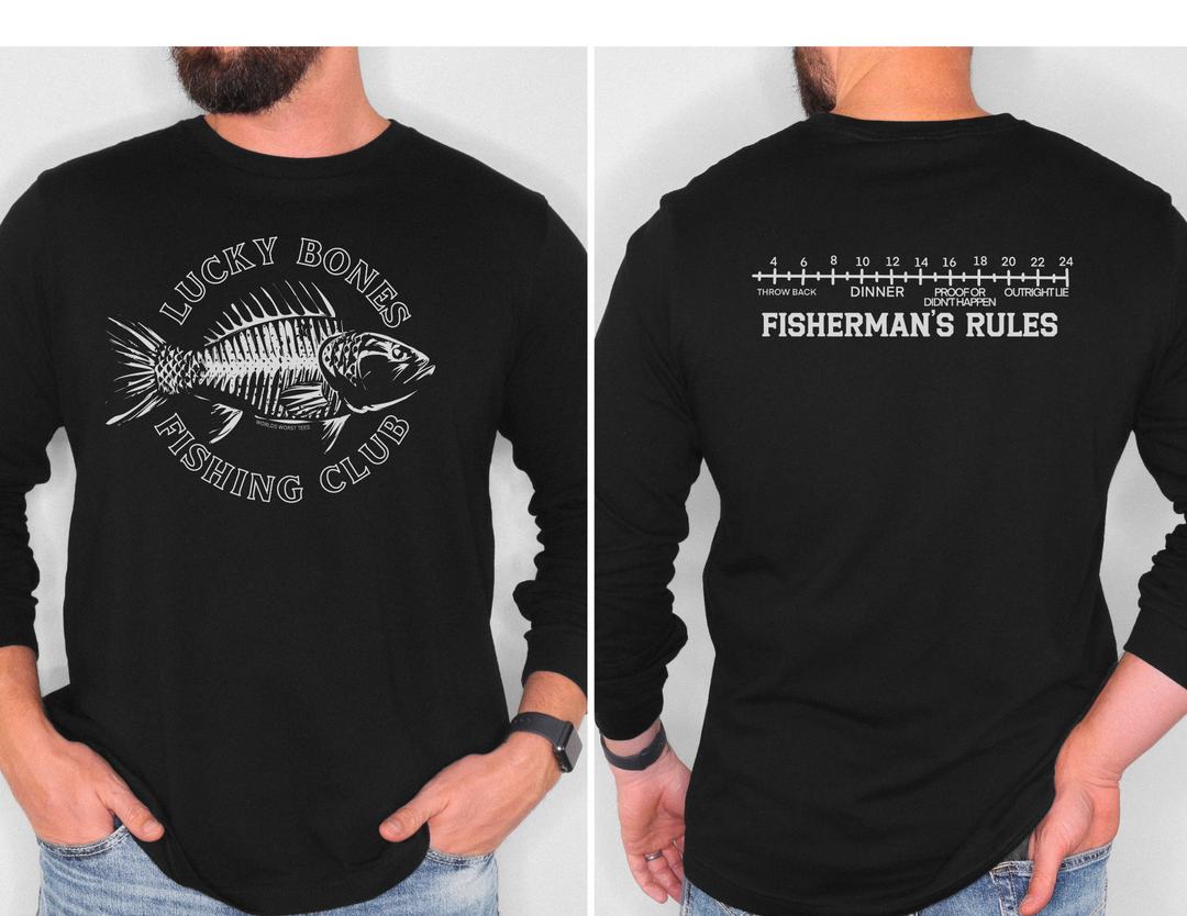 A man in a Lucky Bones Fishing Club Long Sleeve Tee with a fish design, made of 100% ring-spun cotton. Casual, relaxed fit for total comfort. From 'Worlds Worst Tees'.