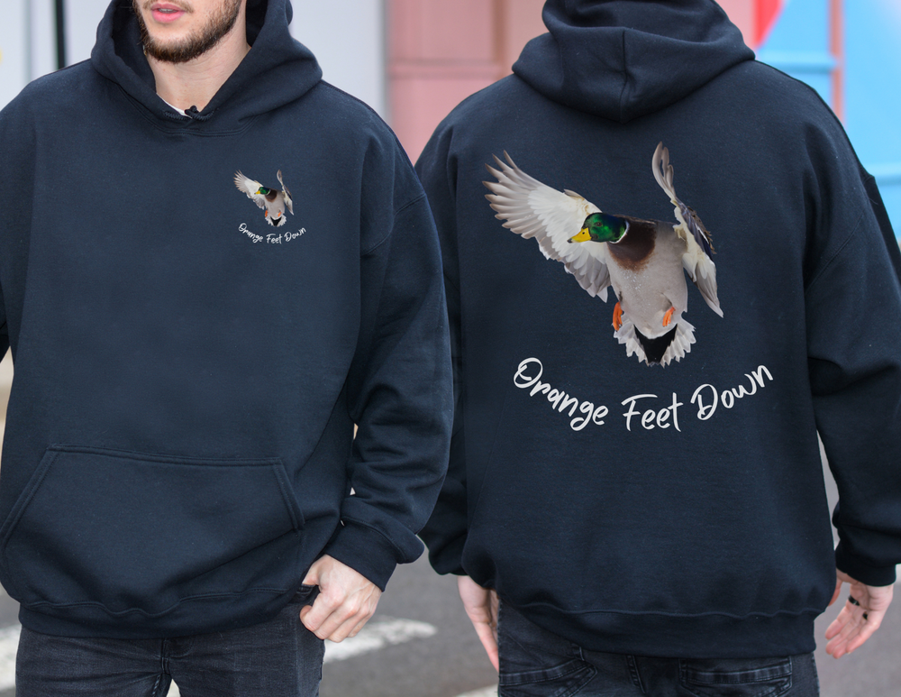 A man wears a black hoodie with a duck design, showcasing the Orange Feet Down Hoodie from Worlds Worst Tees. Made of 50% cotton and 50% polyester, it features a front pouch pocket and a loose fit.