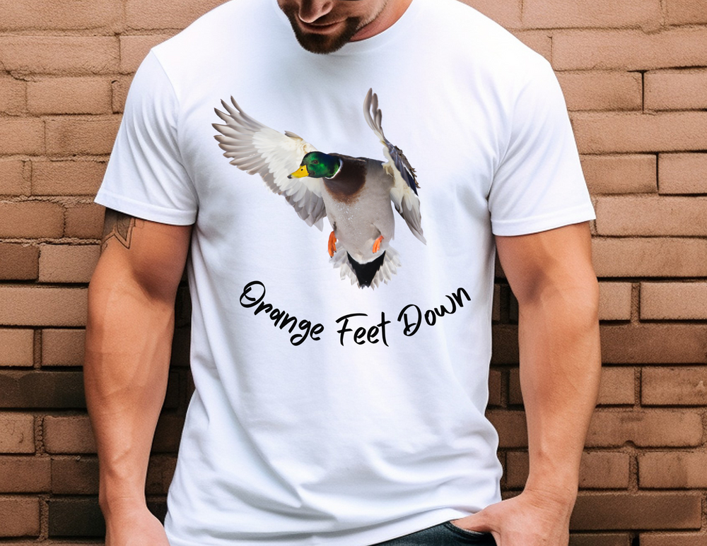 A man in a white shirt with a duck print, showcasing the Orange Feet Down Tee from Worlds Worst Tees. Comfy, light, premium fit tee made of 100% cotton. Ideal for workouts or daily wear.