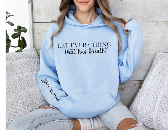 A cozy unisex hooded sweatshirt featuring a woman sitting on a bench, made of 50% cotton and 50% polyester. Perfect for cold days with a kangaroo pocket for practicality and a matching drawstring hood. From Worlds Worst Tees.
