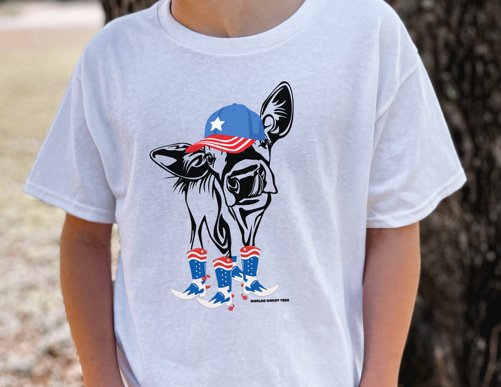 A kids' tee featuring a person in a white shirt with a cow wearing a hat and boots. Ideal for everyday wear, made of 100% cotton, with twill tape on shoulders for durability. Perfect for printing.