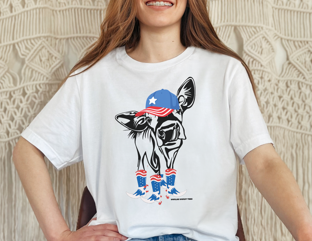 A unisex heavy cotton tee featuring a woman smiling with a cow on a white shirt, embodying casual fashion. No side seams for comfort, tape on shoulders for durability. Perfect for 4th of July Family Rodeo.
