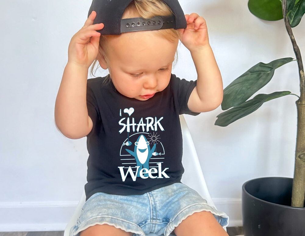 I Love Shark Week Baby Tee showcasing durable, toddler-friendly design with side seams and ribbed knitting for comfort, perfect for young shark enthusiasts.