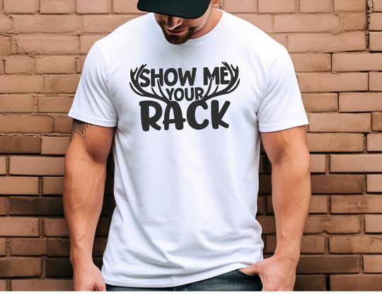 A man in a white Show Me Your Rack Tee, close-up of face and shirt details. Unisex soft-style t-shirt, 100% cotton, tailored fit, twill tape shoulders, no side seams. Casual comfort from Worlds Worst Tees.