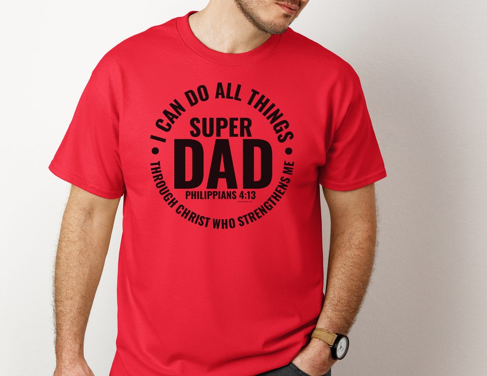 A classic Super Dad Tee in red, featuring a man in a red shirt with black text. Unisex jersey tee made of 100% Airlume combed cotton, with ribbed knit collars and taping on shoulders for durability. Sizes from XS to 3XL.