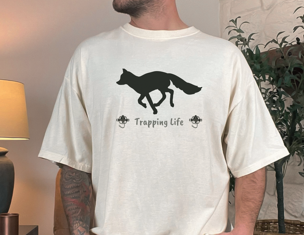 Trapping Life Unisex Tee featuring a man in a white shirt with a fox and UFO design. Classic fit, 100% cotton, sustainably sourced materials. No side seams, ribbed collar, tear-away label.