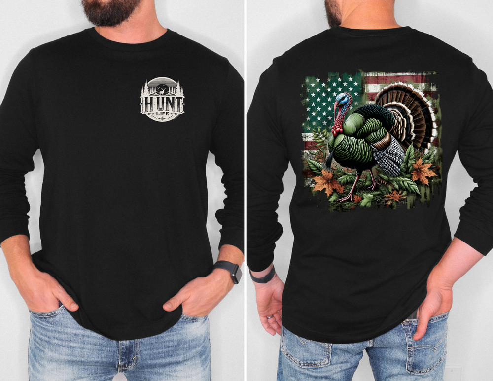 A man in a Turkey Hunting Long Sleeve T-Shirt, featuring a black shirt with a turkey design. Made of 100% ring-spun cotton for softness and style. Classic fit, ideal for casual wear.